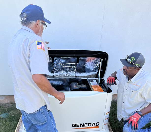 electrician fixing a Generac unit